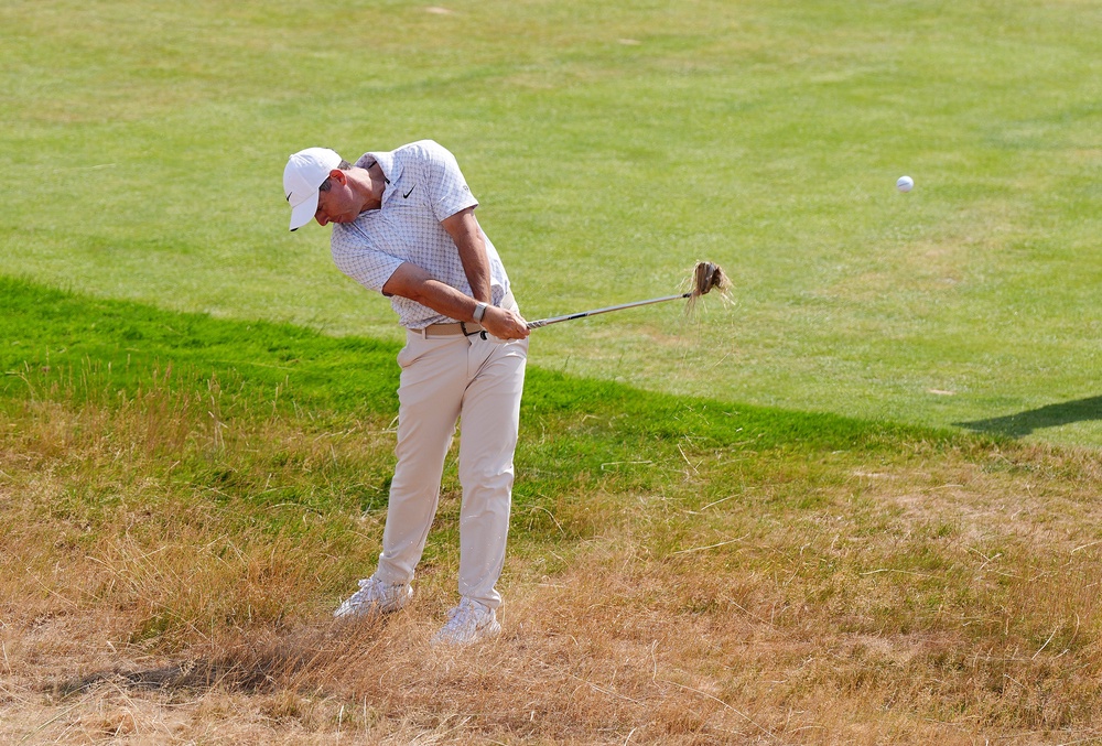 Rory McIlroy plays from the rough (Jacob King/PA) (PA Wire)