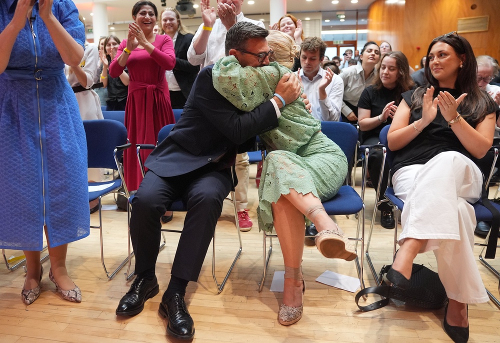 Andy Burnham hugging his wife Marie-France van Heel after being confirmed as the new Labour leader (Yui Mok/PA) (PA Wire)