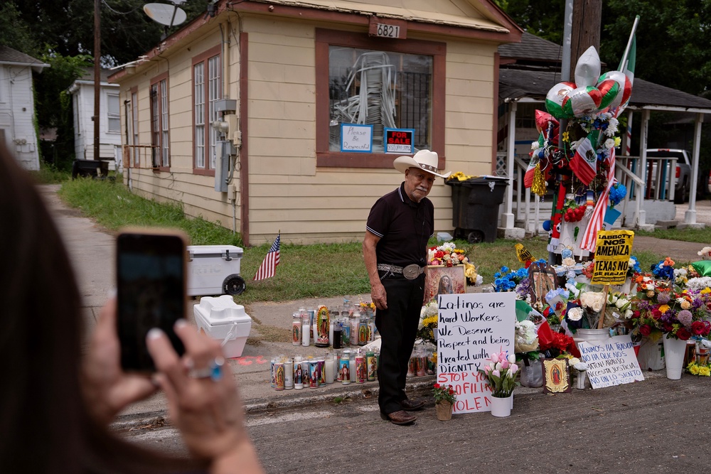 People visit a memorial for Lorenzo Salgado Araujo on July 11 in Houston, Texas. Araujo, a 52-year old Mexican national with three children living in the U.S. for more than 30 years, was shot by an ICE agent during a traffic stop earlier this month (Getty)