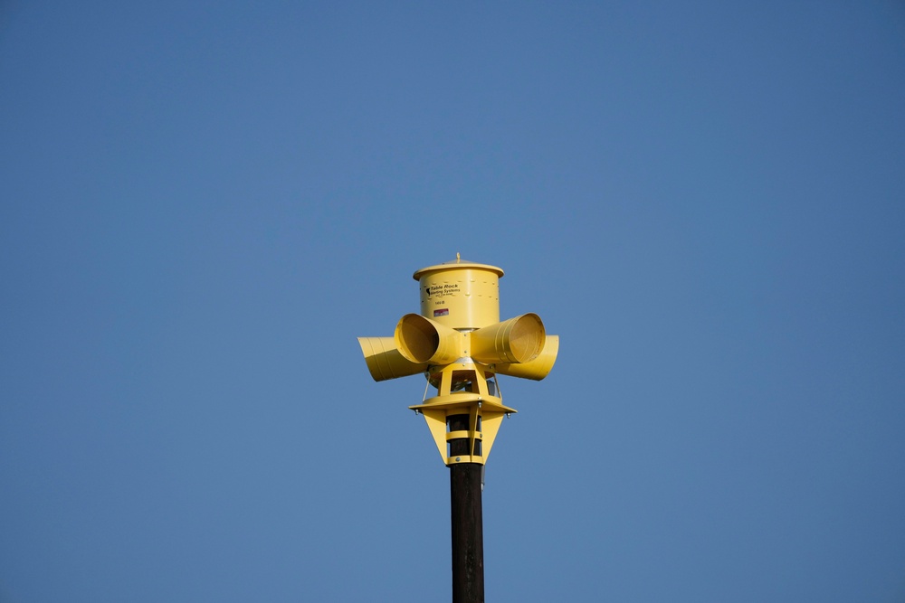 An emergency siren is visible on top of the Comfort Volunteer Fire Department in Comfort, Texas, July 10, 2025 (AP Photo/Ashley Landis)