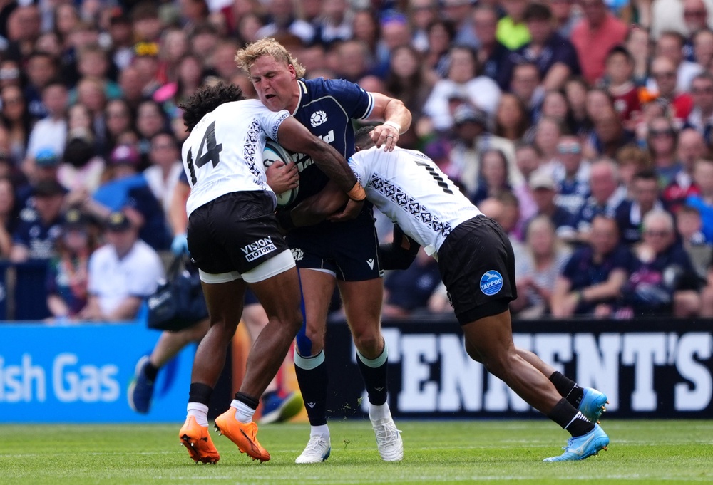 Duhan van der Merwe (centre) is tackled by Selestino Ravutaumada (left) (Andrew Milligan/PA) (PA Wire)