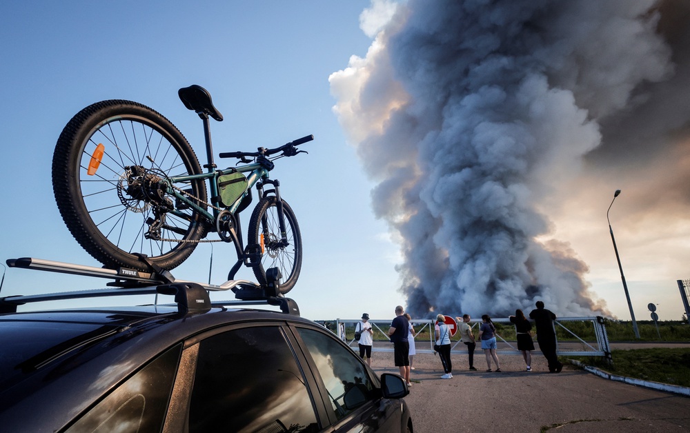 Bystanders watch the fire at the Wildberries complex (AFP/Getty)