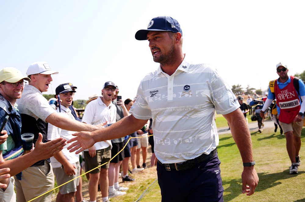 Bryson DeChambeau embraces spectators on his way to the second tee (Jacob King/PA). (PA Wire)