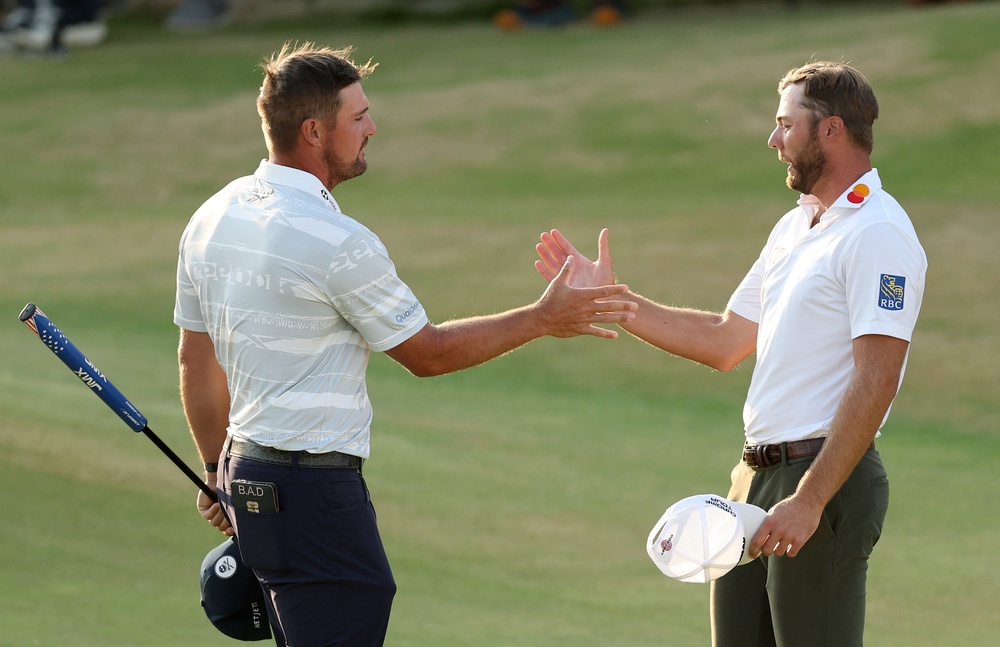 Sam Burns (right) leads The Open but Bryson DeChambeau (left) again stole the headlines (Getty)