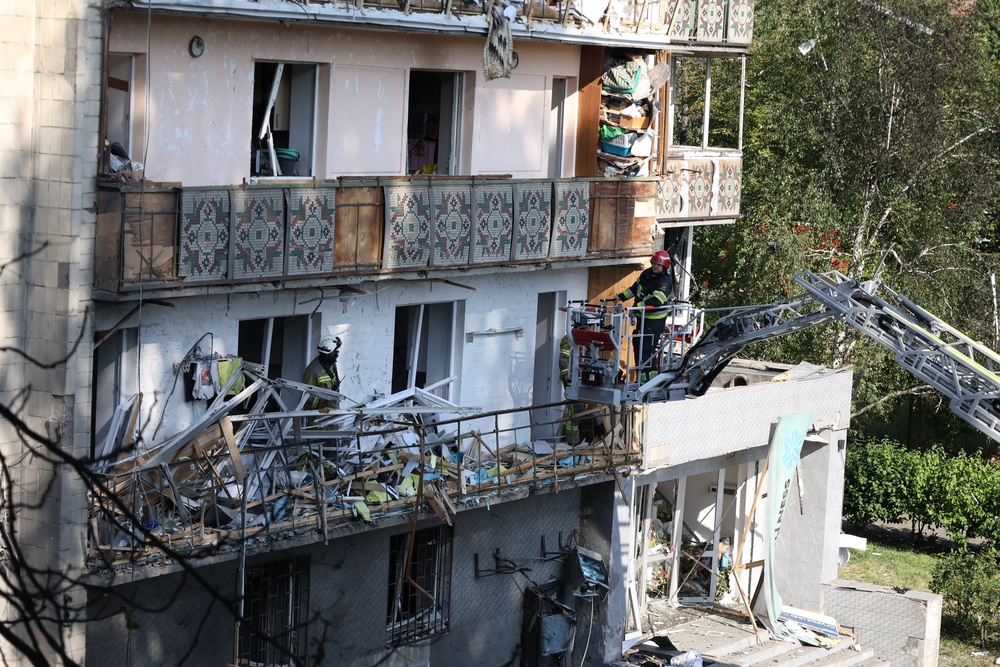 Rescuers work on a residential building following a Russian missile strikes in Kyiv (AFP/Getty)