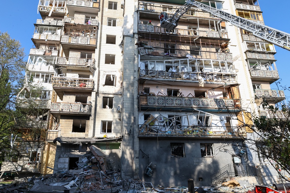Rescuers work on a residential building following a Russian missile strikes in Kyiv (AFP/Getty)