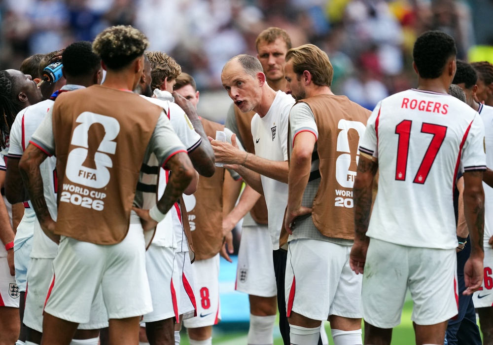 Thomas Tuchel, centre, talks to his England team during the World Cup third-place play-off against France (Martin Rickett/PA)