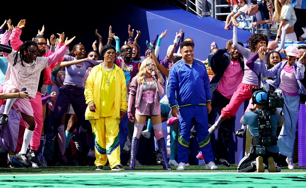 Former Brazil football players Ronaldinho and Ronaldo with Madonna during the half time show (Reuters)