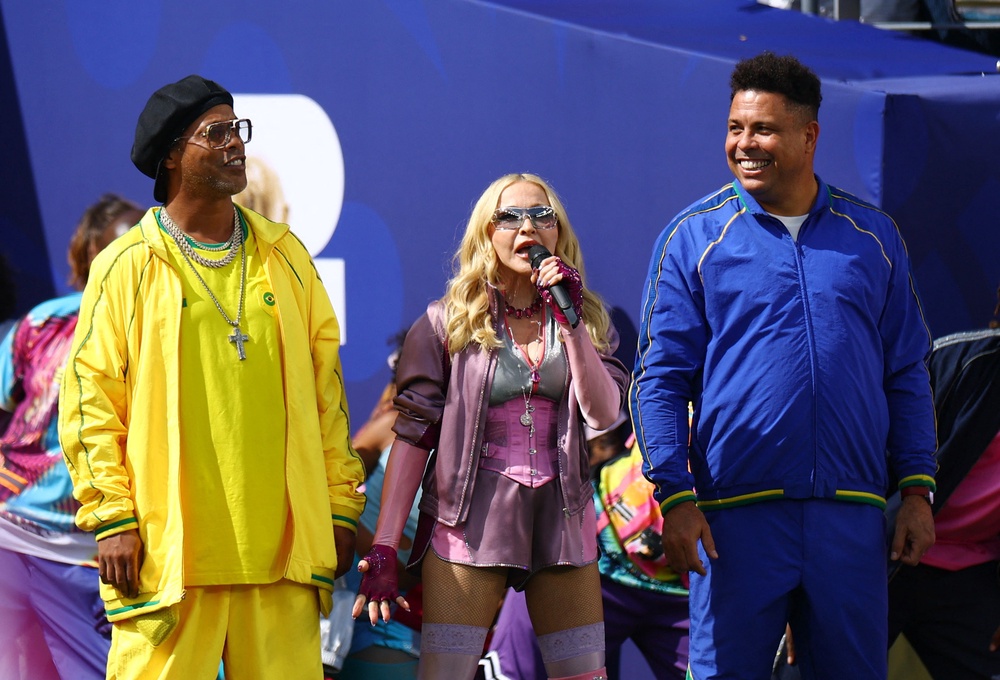 Brazilian legends Ronaldinho and Ronaldo joined Madonna during the first ever Fifa World Cup final halftime show (Reuters)