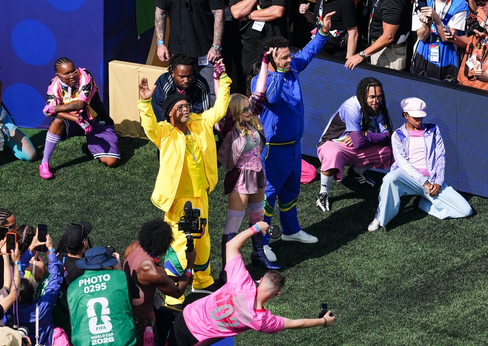 Ronaldinho and Ronaldo with Madonna during the half-time show (Martin Rickett/PA) (PA Wire)