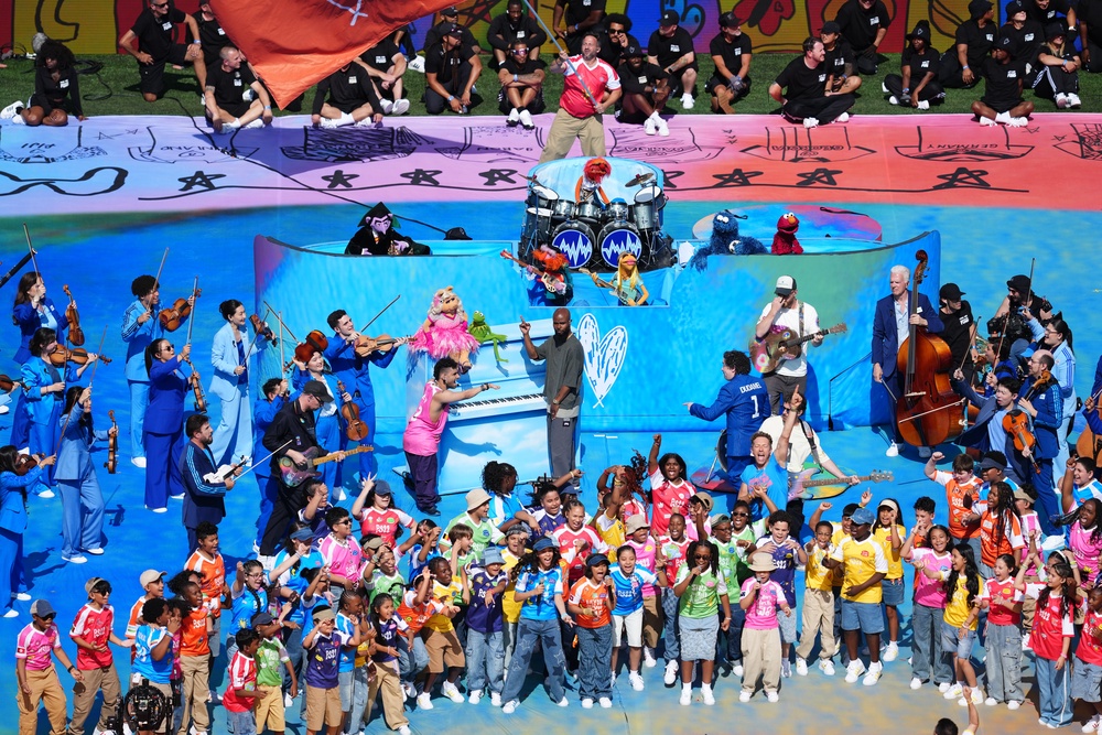 Coldplay and The Muppets perform during the half-time show (PA)