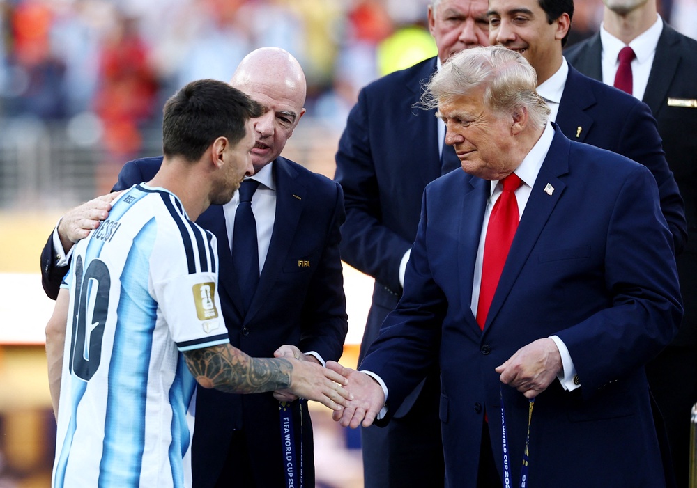 Trump presented Lionel Messi with his runners-up medal (Reuters)