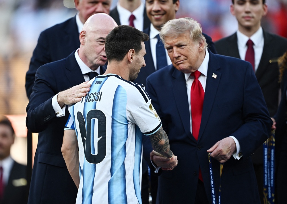 Argentina's Lionel Messi shakes hands with US President Donald Trump (Reuters)