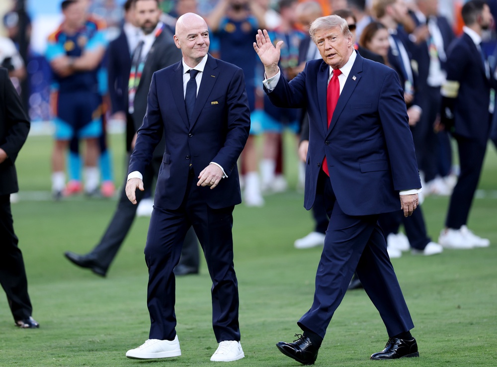 Gianni Infantino and Donald Trump walk onto the pitch before the World Cup presentation (Getty)