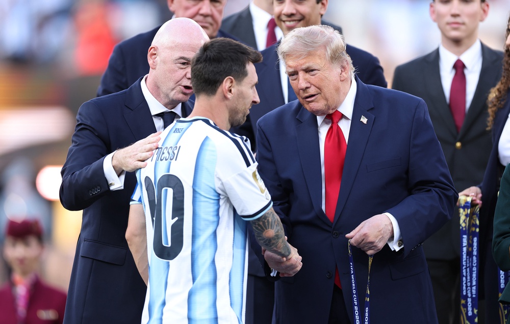 Messi receives his runner-up medal from Donald Trump (Getty)