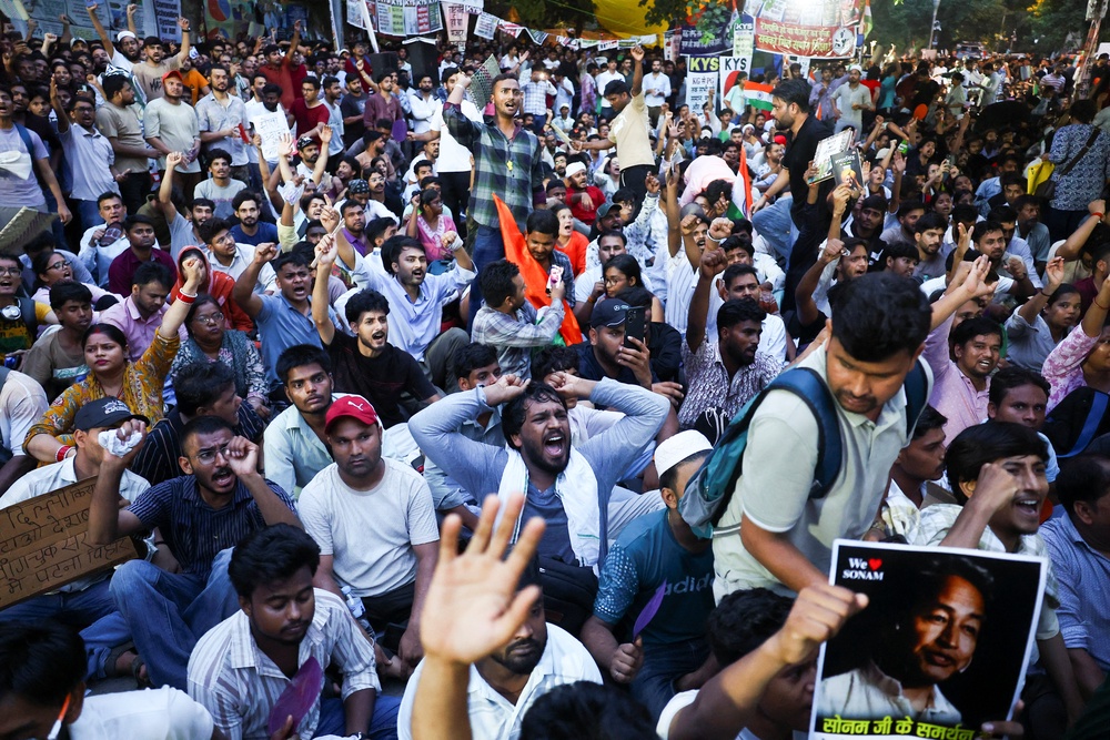 Supporters of the Cockroach Janta Party chant slogans as they gather at Jantar Mantar in Delhi (Reuters)