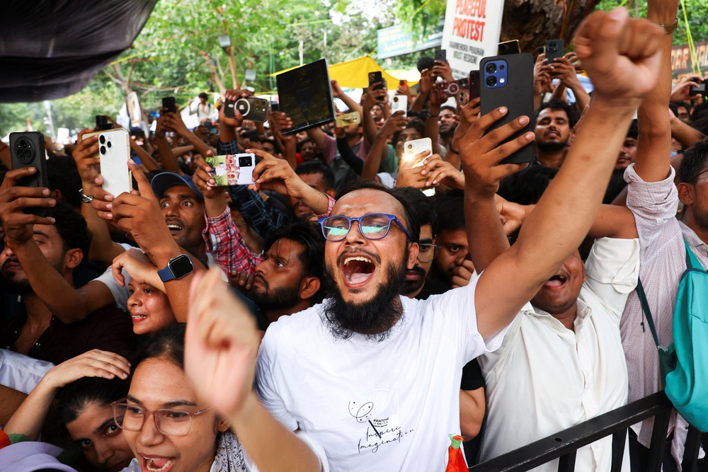 Supporters of the Cockroach Janta Party shout slogans  after activist Sonam Wangchuk is forcibly taken away by police on Saturday (Reuters)