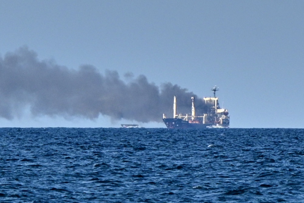Smoke rises from the grain carrier Golden Leo under the Guinea-Bissau flag after Russian missile strike in the Black Sea close to Odesa, Ukraine (AP)