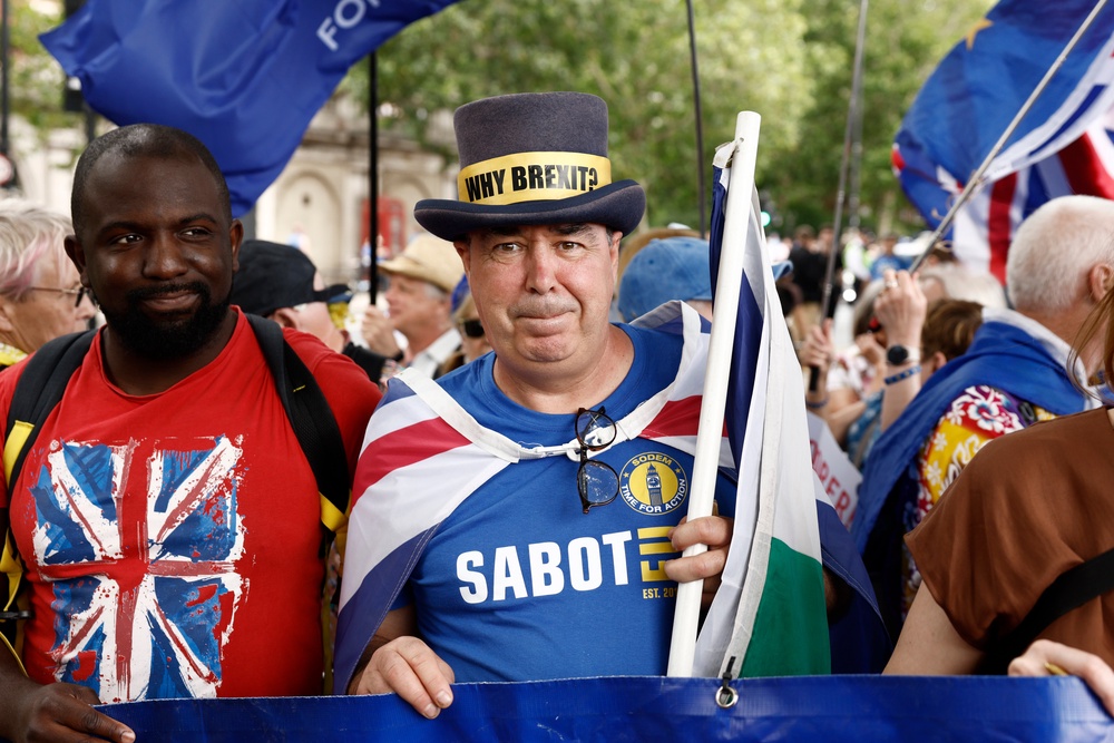 Pro-EU campaigner Femi Oluwole (L) and Anti-Brexit campaigner Steve Bray join demonstrators for a Rejoin rally to mark the 10th anniversary of the UK's EU Referendum, June 20 2026 (Getty)