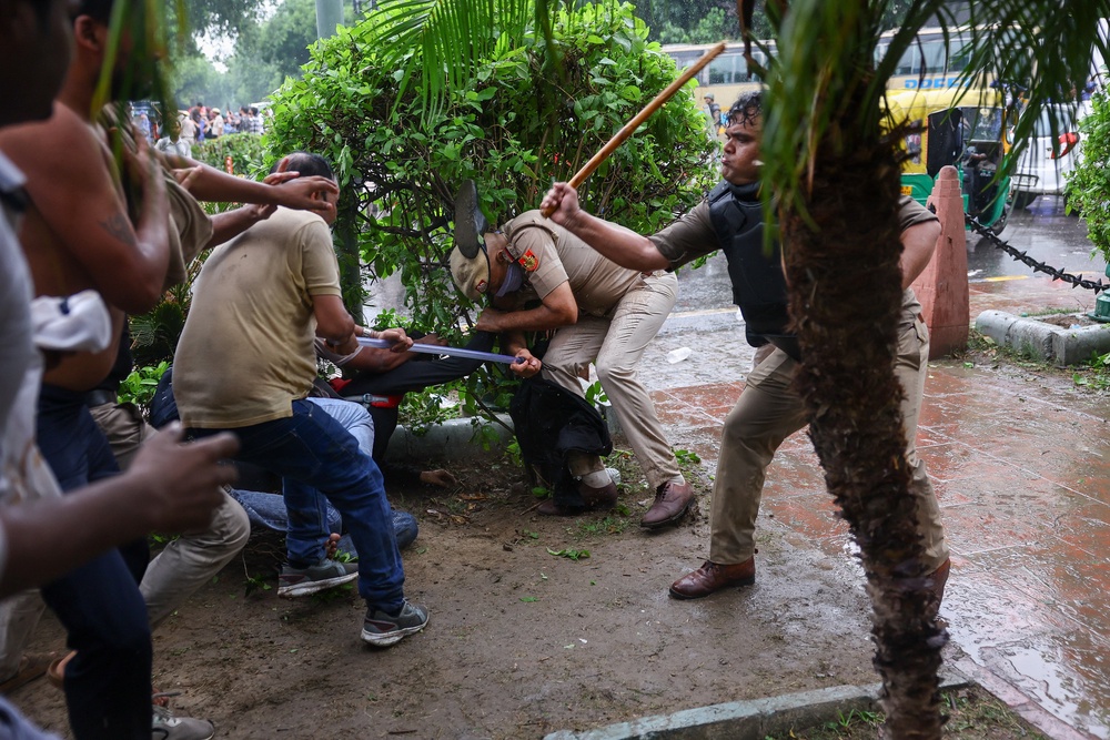 Police use batons to quell protesters (Reuters)