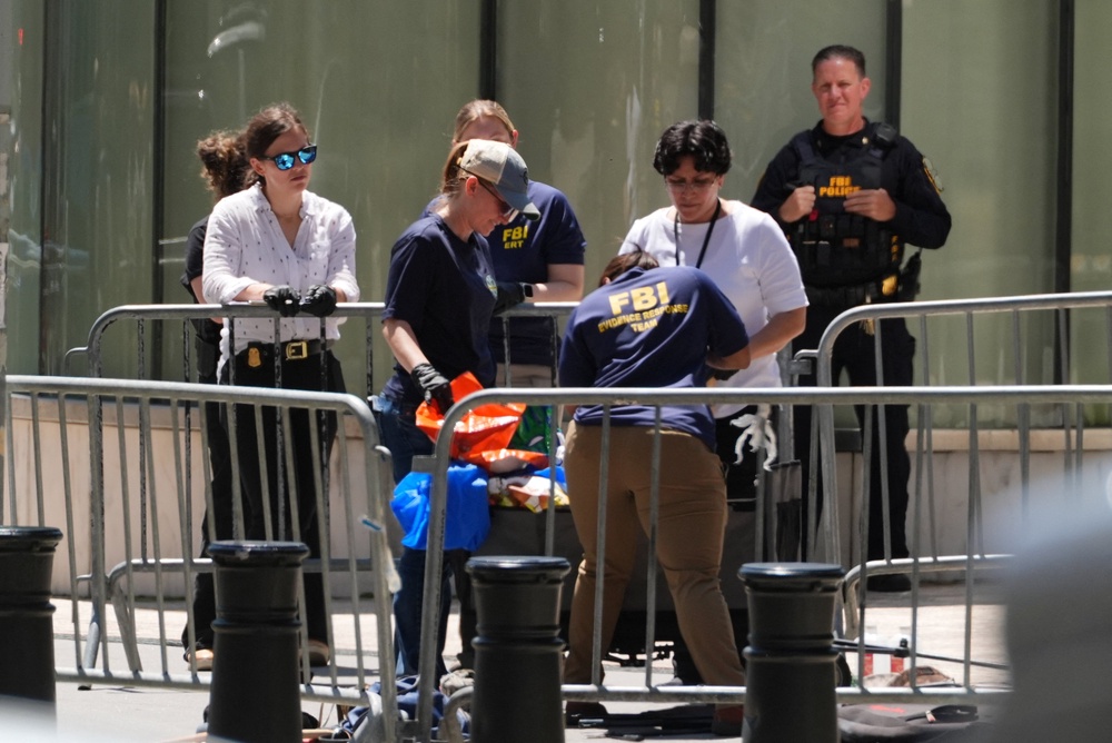 The suspect, identified as 43-year-old Andrew Arrabaca, brought a cart that had a sign reading ‘ICE off our streets’ (Reuters)