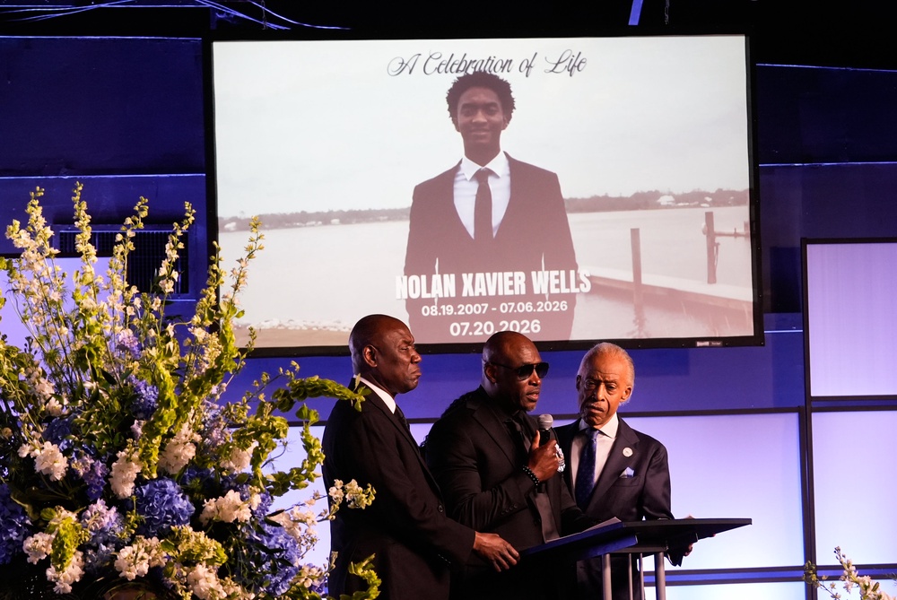 At the funeral, Wells' father, Elmore Wonsley, recalled the hours the two spent studying game tape and running drills on the beach. (AP Photo/Gerald Herbert)