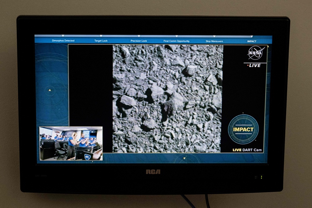 A TV at Nasa’s Kennedy Space Center in Cape Canaveral shows the final images from the Dart test (AFP/Getty)