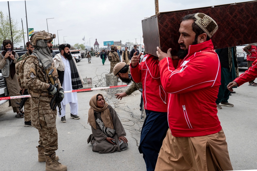 Afghan volunteers carry the coffin of a victim of the alleged Pakistani airstrike on a drug rehabilitation centre in Kabul (AFP via Getty)