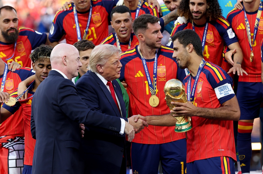 Trump and Fifa president Gianni Infantino presented the World Cup Winner’s Trophy to Spain captain Rodri on Sunday (Getty)