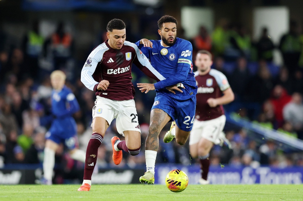 Reece James of Chelsea battles for possession with Morgan Rogers of Aston Villa (Getty)