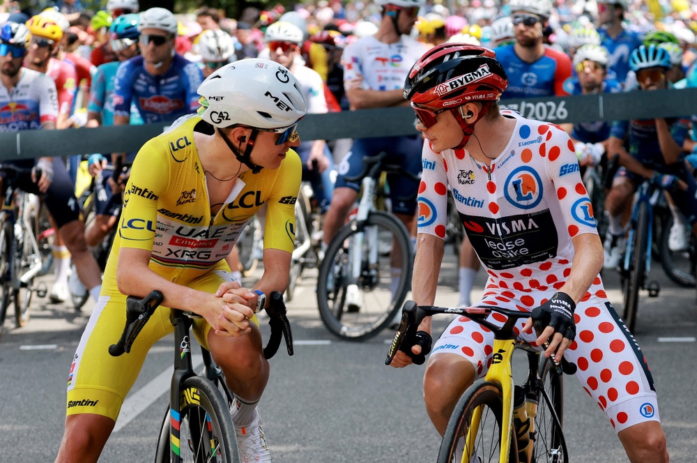Vingegaard (right) will not defend his title after breaking his collarbone at the Tour (Reuters)