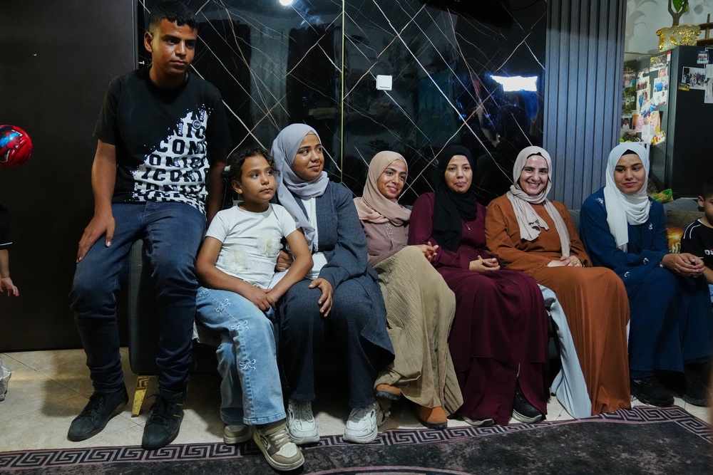 Mais Al-Gharam, second from right, poses for a photo with her six siblings from Gaza, who were granted Israeli passports, in her home in Nazareth, Israel, Wednesday, July 8, 2026. (AP Photo/Mahmoud Illean) (Copyright 2026 The Associated Press. All rights reserved)