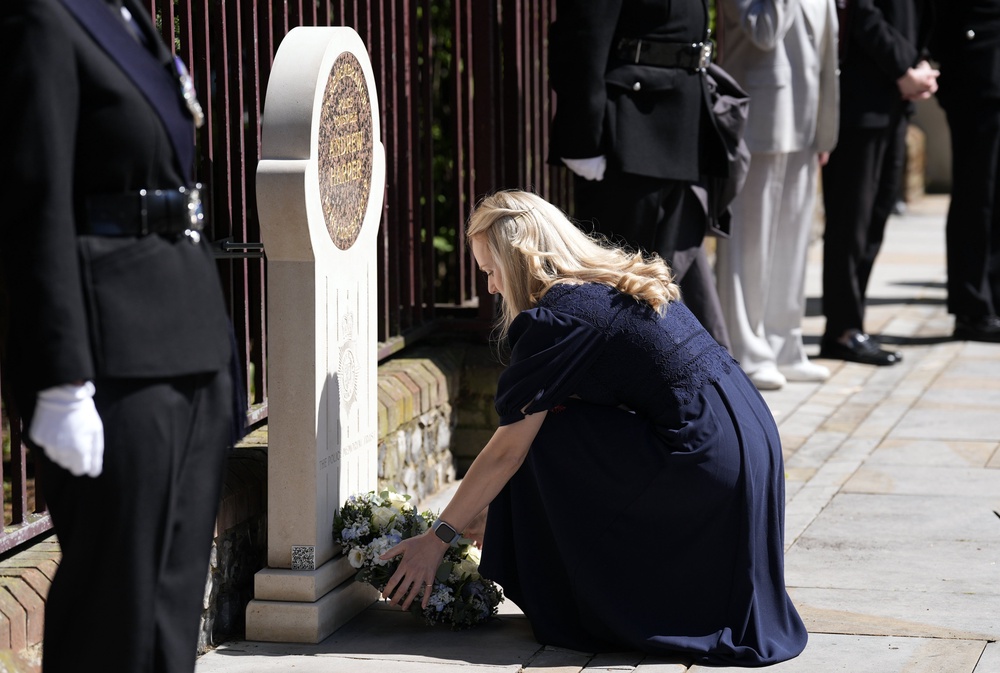 Andrew Harper’s widow Lissie Harper lays a wreath at a memorial stone in Reading (Andrew Matthews/PA) (PA Wire)