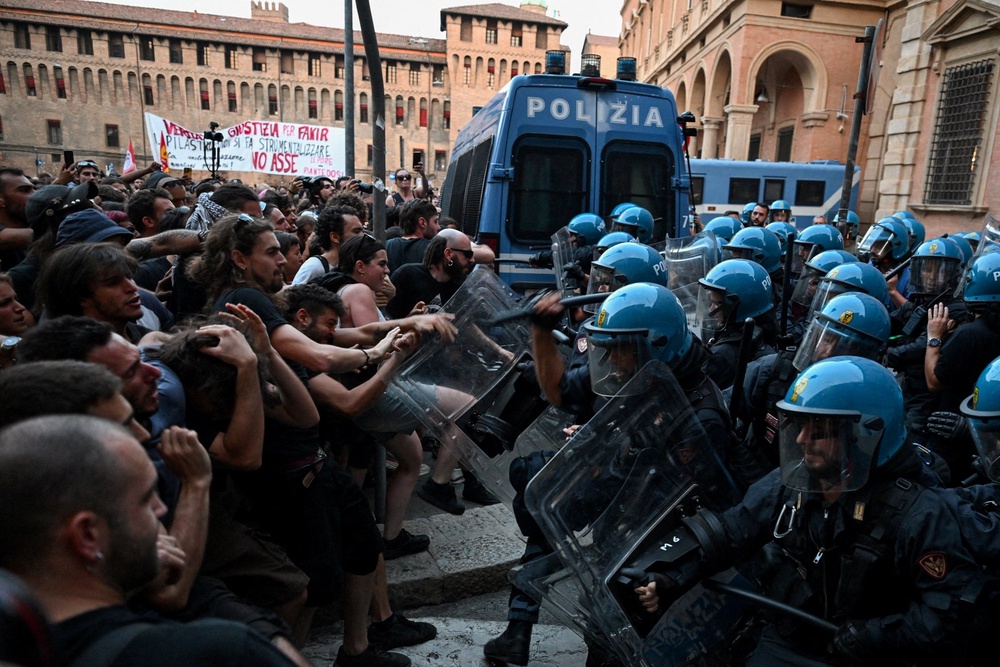 Protesters clash with riot police during a protest following the death of Abderrahim Fakir after he was restrained by police during an attempted detention, in Bologna, Italy, July 20, 2026. (Reuters)