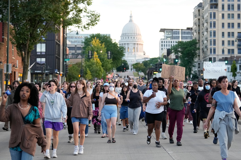 Protesters march close to the Capitol building in downtown Madison (Copyright 2026 The Associated Press. All rights reserved.)
