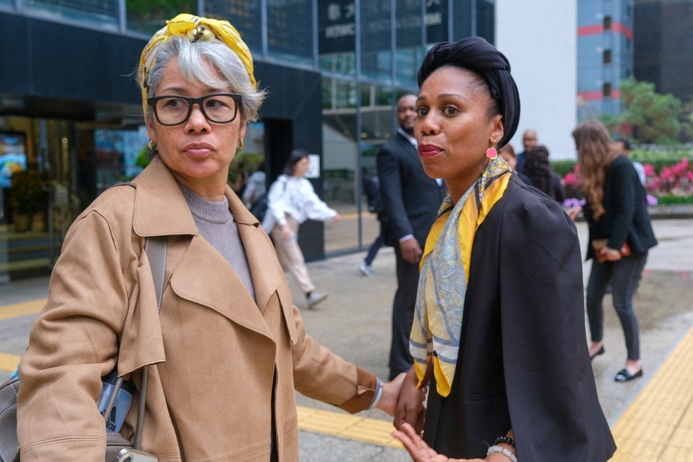 Aysha Bell, right, mother of Isabel Rose, reacts outside the Hong Kong District Court on 3 March 2026 (AFP/Getty)