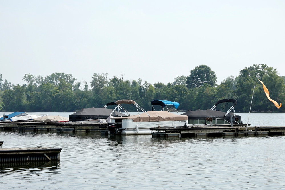 Boats sit moored on the Scioto River near where multiple people died after several of them went into the water to help another person who was struggling to swim (AP)