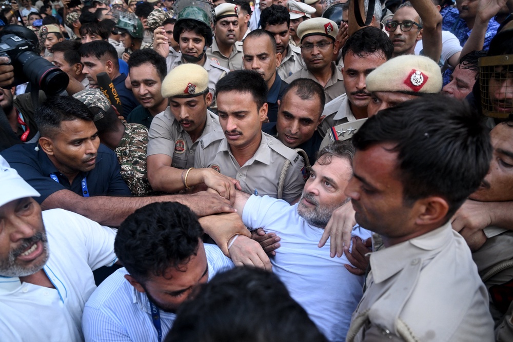 Rahul Gandhi being dragged away after his sit-in outside Narendra Modi’s residence (AFP/Getty)