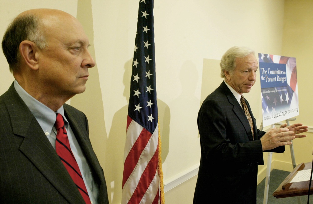 Senator Joe Lieberman (D-CT) (R) gestures while he speaks as Woolsey (L) listens on Capitol Hill July 20, 2004 (Getty)