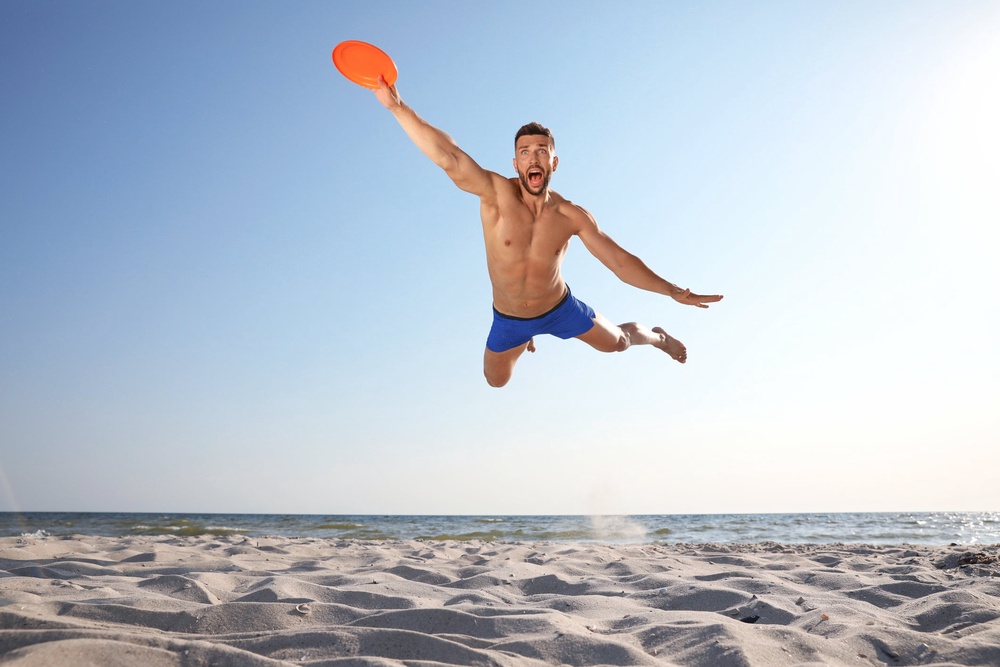 Feeling the pressure to join a game of beach frisbee against your will this summer? You're not alone (Getty/iStock)
