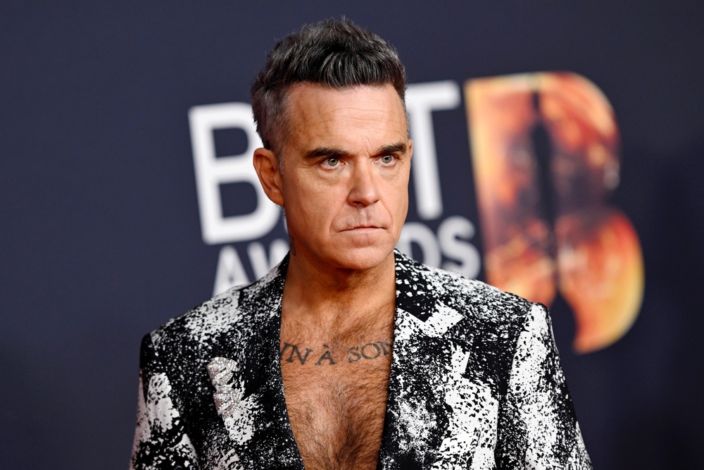 Robbie Williams has not hidden the fact that he would love to headline Glastonbury (Getty)
