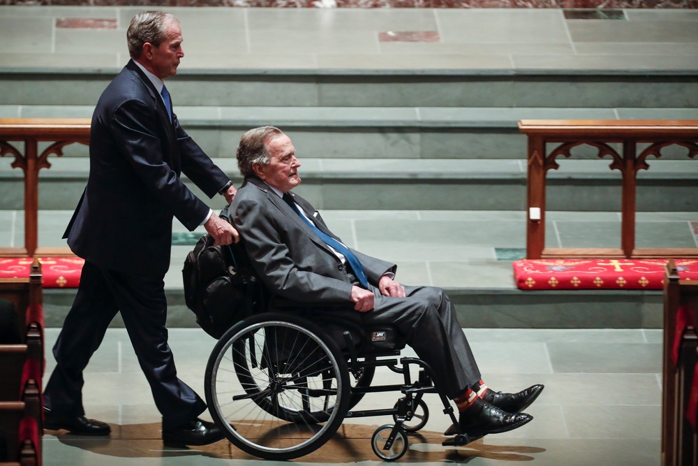 From the earliest days of the republic, America has embraced the concept of politics as a family business. Pictured: Former president George W. Bush, left, wheels his father, former president George H.W. Bush into the church for the funeral for former first lady Barbara Bush in 2018 (Getty Images)