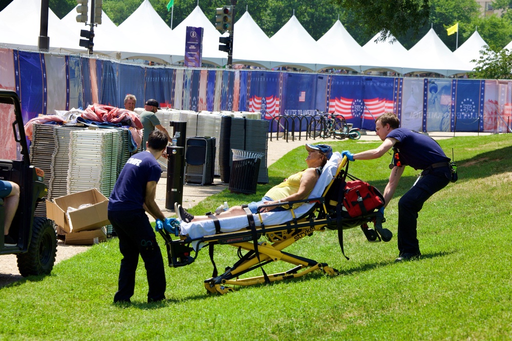 A person is helped by first responders at the National Mall in Washington, DC, during a heat dome earlier this month. Heat is the number one weather-related killer in the US (AFP via Getty Images)