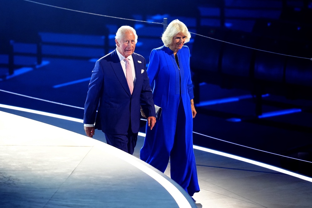 Charles and Camilla making their way down a ramp before taking up seats in the royal box (Jane Barlow/PA) (PA Wire)