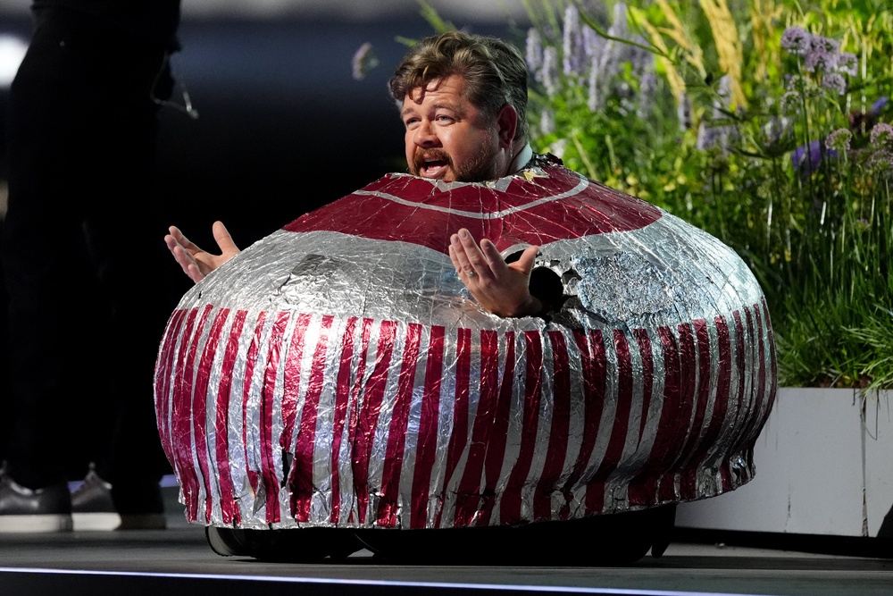 Actor and wrestler Grado dressed as a giant Tunnock’s Tea Cake during the pre-ceremony show (Andrew Milligan/PA) (PA Wire)