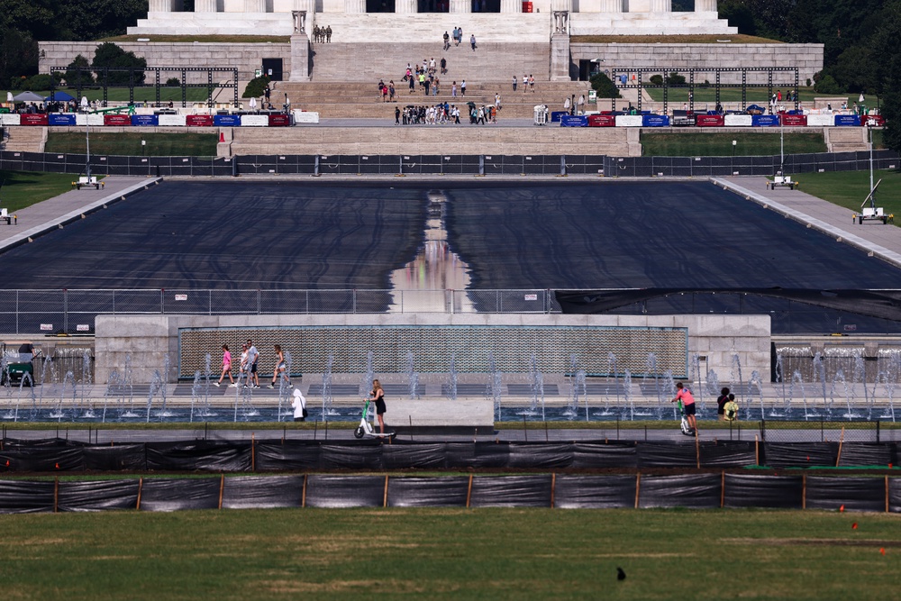 Trump has claimed vandals cut a 350-foot gash in the Reflecting Pool, though photos of the newly re-drained monument do not clearly show the kind of massive slice the president has described (Getty)