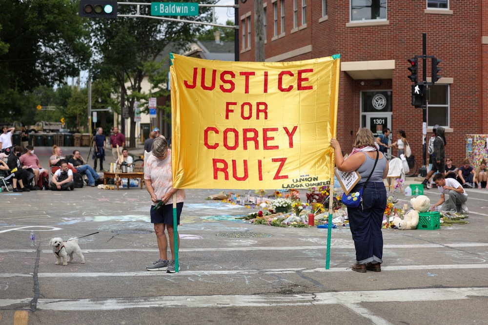 Protesters temporarily took over a press conference on Thursday about the shooting, demanding that the officers involved in the arrest and killing of Corey Ruiz be put in prison (Reuters)