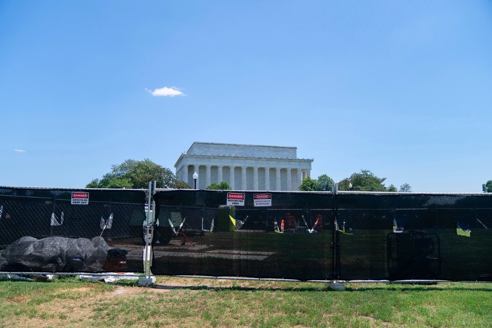 The repairs to the pool — and the ensuing controversy around them — have turned the site into an even bigger tourist attraction, and park police and National Guard troops have patrolled around its exterior (AP)