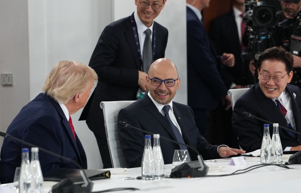 US president Donald Trump, left, and South Korean leader Lee Jae Myung, right, during a working lunch meeting of G7 members in Evian, France, on 17 June 2026 (AFP/Getty)