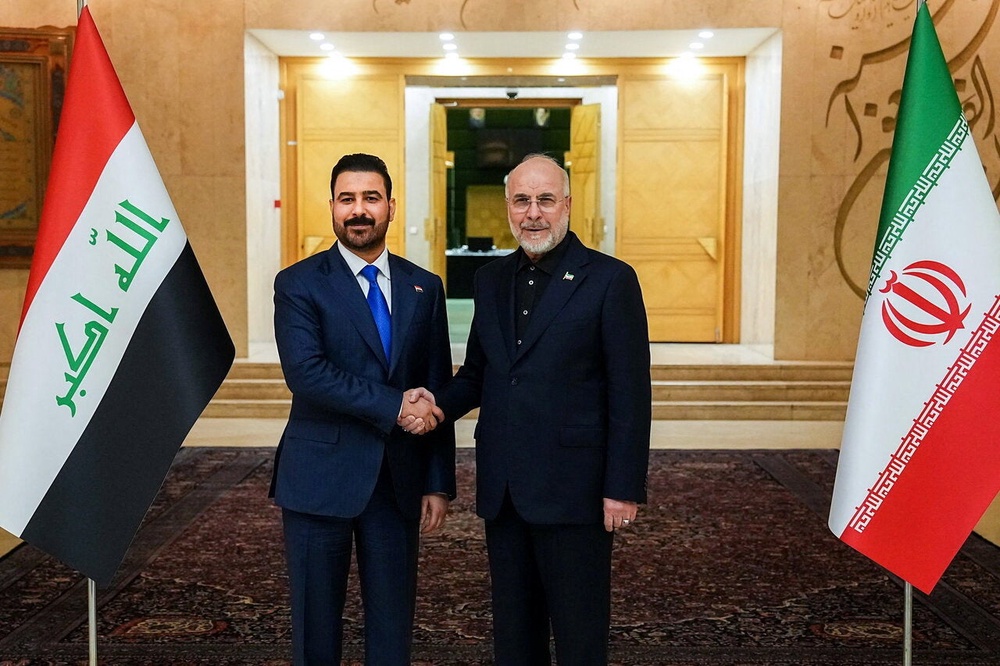 Iranian Parliament Speaker Mohammad Bagher Ghalibaf shakes hands with Iraqi Prime Minister Ali al-Zaidi in Tehran, Iran July 23 (Reuters)